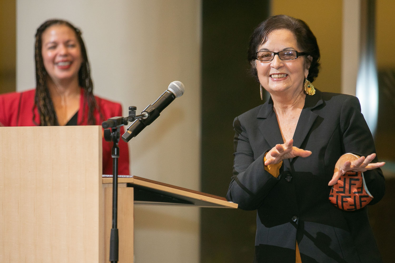 Brooklyn College alum and former vice president for student affairs, Milga Morales Nadal ’70, ’74 M.S. engages the audience at the Hispanic Heritage Month celebration at the Tow Center while Assistant Dean for Student Life Moraima Smith looks on. Nadal received an award 'in recognition of her service and commitment to the betterment of the Hispanic and Latinx community at Brooklyn College.'