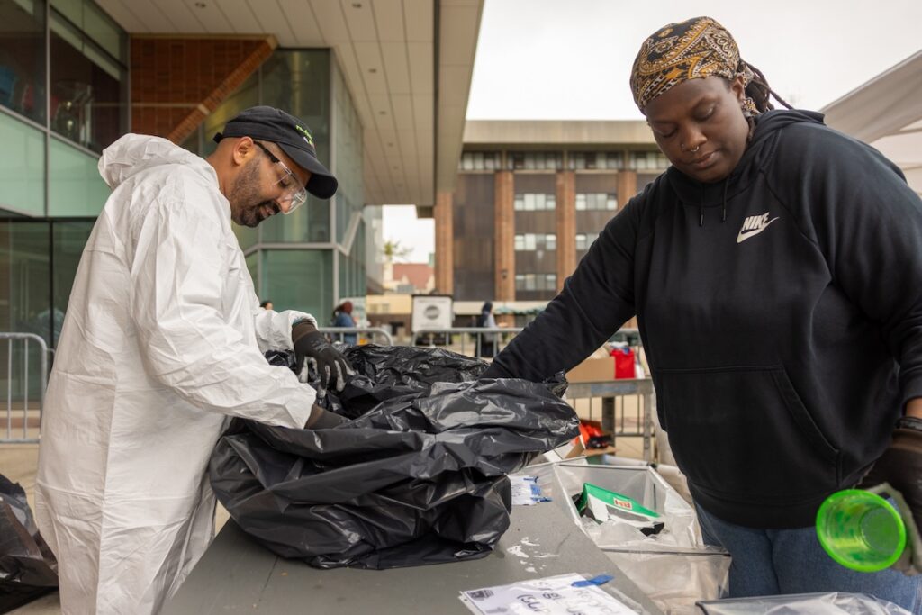 Stalin Espinal, sustainability coordinator from the Office of Environmental Health and Safety, and Yarnelle Bauzil, coordinator for the college’s community garden, separate trash at the college’s first large campus waste audit, which will help assess recycling practices. The waste audit team sorted 506 pounds of waste: Of the total waste stream, there were 197.7 pounds of paper and cardboard materials; 34.5 pounds of metal, glass, plastic, and carton materials; 227.51 pounds of landfill-bound trash materials, and 46.3 pounds of compostable and organic materials.
